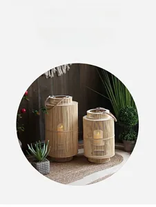 Detail of handcrafted bamboo woven lanterns with rope handles in a cozy home setting