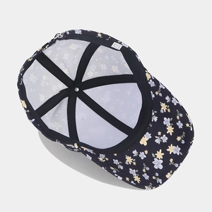 Navy floral baseball cap with yellow flower patterns and interior structural details