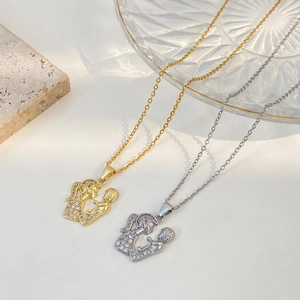 Mother and child hugging necklace with sparkling crystals in gold and silver tones