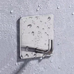 Waterproof stainless steel adhesive hook with brushed finish on a grey textured wall
