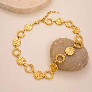 Detail of 18k gold plated circle necklace with lobster clasp on stones