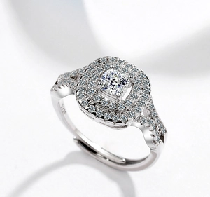 Macro close-up of double halo cushion cut zirconia ring with adjustable silver band