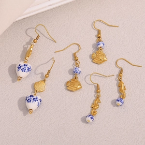 Detailed set of 18K gold-plated fish, shell and seahorse blue and white ceramic earrings