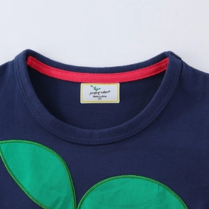 Navy blue girls knit dress with green leaf appliqué and detailed crew neck stitching