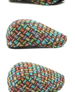 Detail view showing colorful woven jacquard plaid pattern on ethnic style flat cap