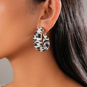 Zebra print leather-wrapped C-shape hoop earrings for a stylish animal print jewelry look