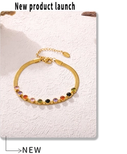 Detail of 18k gold plated snake chain bracelet with vibrant colorful zircon stones