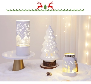 Detailed view of white cutout Christmas lanterns with glowing warm LED holiday patterns