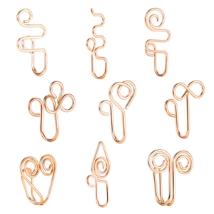 Detail of nine rose gold U-shaped non-piercing nose clips with spiral swirl designs