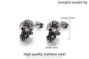 Detailed view of skull stud earrings with crystal eyes showing dimensions 13mm by 6mm
