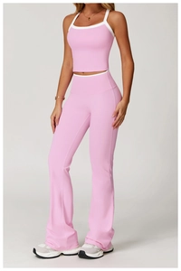 Close-up of pink high-waist flared sports leggings with white contrast trim details