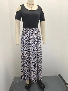 Detail of cold-shoulder short sleeve top with high-waist leopard print long dress