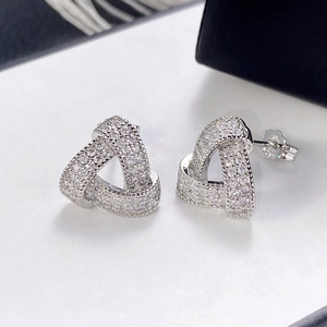 Macro shot of S925 sterling silver geometric triangular earrings with paved zircons