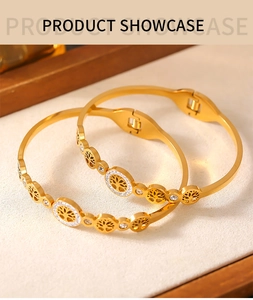 Detailed view of gold Tree of Life bracelet with hollow design and inlaid white diamonds