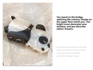 Detailed view of a cute panda hair claw clip made of premium acetate with iridescent finish