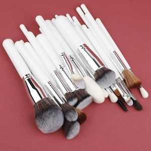Detail of 30pcs professional makeup brush set with white handles and bicolor bristles