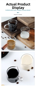Detail of 70ml heat-resistant glass measuring cup with wooden handle and scale markings