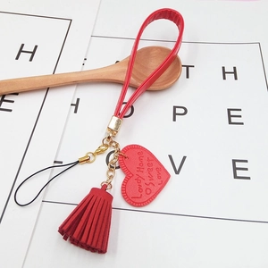 Red faux leather heart strap with tassel and gold metal clasp for phone cases