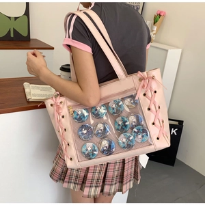 Pink Japanese Ita bag featuring a clear PVC window filled with anime character badges