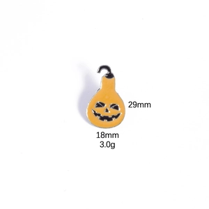 Detailed macro view of orange pumpkin enamel brooch with 29mm height and 18mm width dimensions