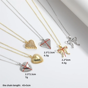 Minimalist gold and silver love heart and bow pendant necklaces displayed on white background