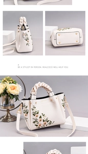 Detail of white leather bag featuring colorful floral embroidery and woven top handle