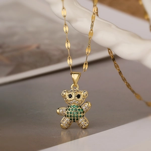 Gold plated teddy bear pendant necklace with green and white cubic zirconia crystals