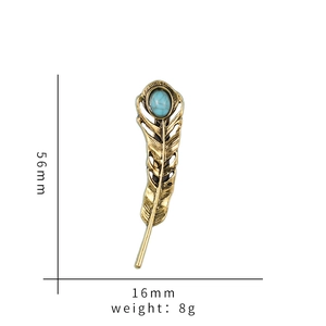 Vintage gold feather brooch with turquoise stone inlay, dimensions 56mm by 16mm
