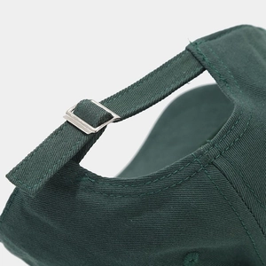 Macro view of adjustable metal buckle and cotton fabric strap on the baseball cap