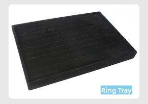 Detail view of black velvet ring display tray with professional grid slot arrangement
