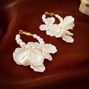 Elegant French pearl flower earrings with gold metal hoops and translucent petals