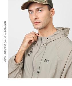 Detail of light khaki jacket featuring Jeep SPIRIT branding and adjustable drawstring hood
