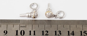 Microphone pendants with silver finish and gold accents measured next to a ruler