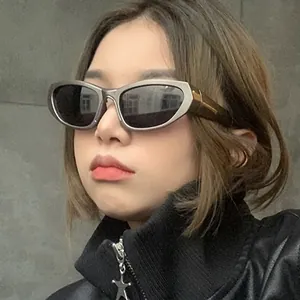 Futuristic silver Y2K oval sports sunglasses with gray PC lenses on female model