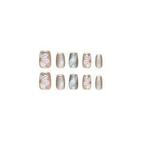 Cat eye press-on nails set with floral daisy designs and shimmering gray marble patterns