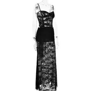Detail of floral lace texture on two-piece sexy black crop top and long skirt set