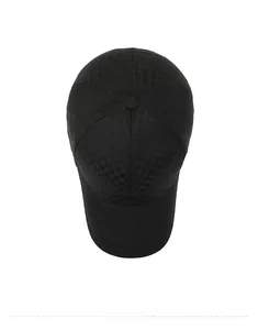 Top down view of black baseball cap featuring subtle checkered pattern fabric texture