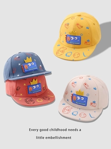 Detail of colorful kids baseball caps with 3D dinosaur prints and silicone patches