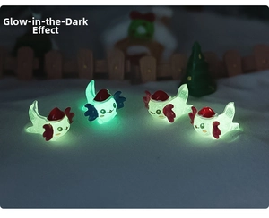 Close-up of four luminous Christmas axolotl figurines glowing green on snowy background