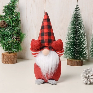 Detail of Christmas gnome with red buffalo plaid hat and plush white beard decor