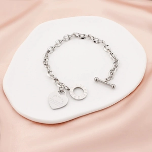 Elegant stainless steel heart charm bracelet with OT toggle clasp and Bible verse engraving