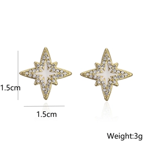 Detail showing 18K gold star stud earrings with white enamel and sparkling zircons