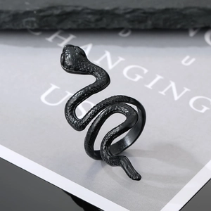 Macro view of matte black snake ring showcasing detailed scale texture and gothic design