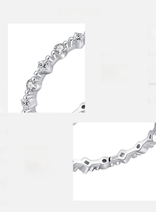 Macro detail of S925 sterling silver ring with irregular hand-set cubic zirconia stones