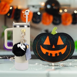 Halloween-themed Stanley cup accessories set with ghost straw cover and plush pompom charm