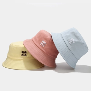 Pastel candy-colored cotton bucket hats with side embroidery in yellow, pink and light blue