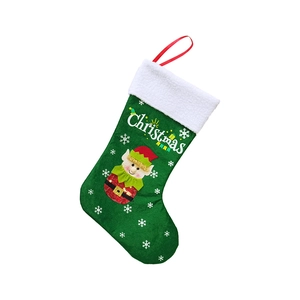 Detail of a green felt Christmas stocking featuring a cartoon elf and white snowflake patterns