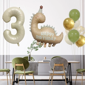 Dinosaur birthday set featuring number 3 balloon and green latex balloons in dining room