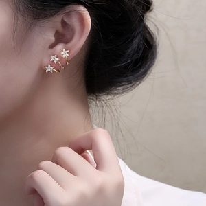 Three-piece gold-tone star ear cuffs set with micro-pave white cubic zirconia stones