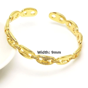 Detailed close-up of 9mm gold chain link bracelet with pave zircon anchor links